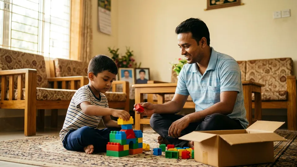 বসার ঘরের মেঝেতে একটা ছোট ছেলে রঙিন বিল্ডিং ব্লক দিয়ে একটা ঘর বানাচ্ছে, পাশে বসে তার বাবা একটা ব্লক এগিয়ে দিচ্ছেন, পাশে খোলা বাক্স